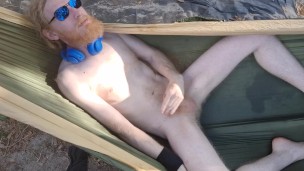 Nudist loses his clothes and cums for you in a hammock