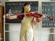 Indian Teacher play Violin Lessons in her class room 1/16