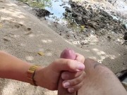 Cumshot handjob at a secret beach 14/16