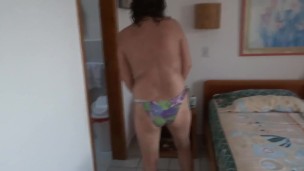 Beautiful stepmom in a bikini masturbates standing up before getting fucked.