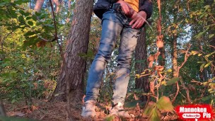 Guy long pissing in the forest under a tree