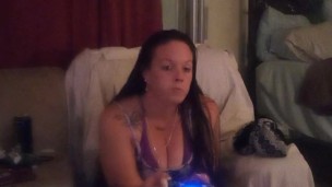 Sexy long hair brunette bbw eating pizza and smoking cigarettes while playing video games
