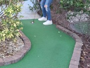 Small petite girl playing golf and not doing good at it 5/16