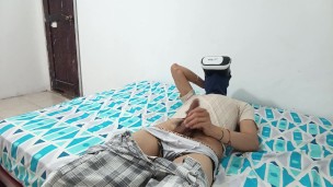 Masturbator masturbates while watching porn in his VR headset