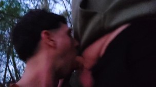 Young twink giving a public blowjob to horny cruising dude at forest and sperms out from his hand