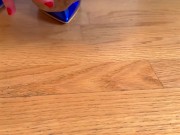 The girl in a gorgeous blue dress and beige stockings is putting on her stockings 6/16