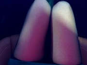 The girl lifts her skirt in the car and shows her black stockings 10/16