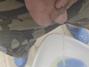 Peeing in public restroom.  Yes, the heart is tattooed. 6/16