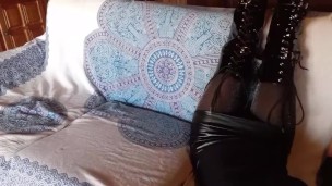 Total black with fishnets pantyhose and boots over the knee