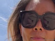 23 asian wife gives handjob on the beach in fishnet dress 7/16