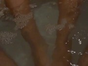 She uses her little feet to play with my cock in the hot tub. 9/16
