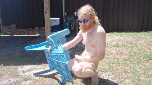 Nudist basks in the sun with his cock and ass out for display
