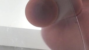 UpClose View Through The Glass, Sitting, Riding, and Then Cumming On Her Big Dick Dildo