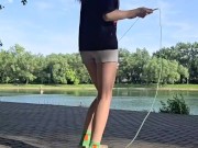 Girl jumping rope in nature 11/16