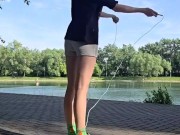 Girl jumping rope in nature 12/16
