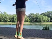 Girl jumping rope in nature 9/16