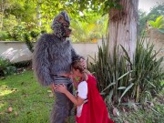 Little Red Riding Hood lost a fruit from her basket and is looking for it in the wolf's pants.