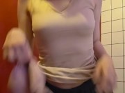 Charming girl takes off her bra from under her T-shirt 15/16