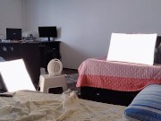 Amateur wife having fun trying on clothes that she cuts off. 1/16