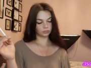 Teen latina brunette with blue eyes teases you with slow, seductive smoking 1/16