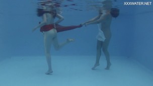 Girlfriends enjoy swimming naked together