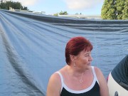 Trashy MILF slut pisses on the grass in front of other campers at the beach 13/16