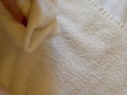 The guy finished the girl right on her foot and she wipes it with a towel 15/16