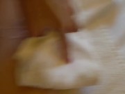 The guy finished the girl right on her foot and she wipes it with a towel 3/16